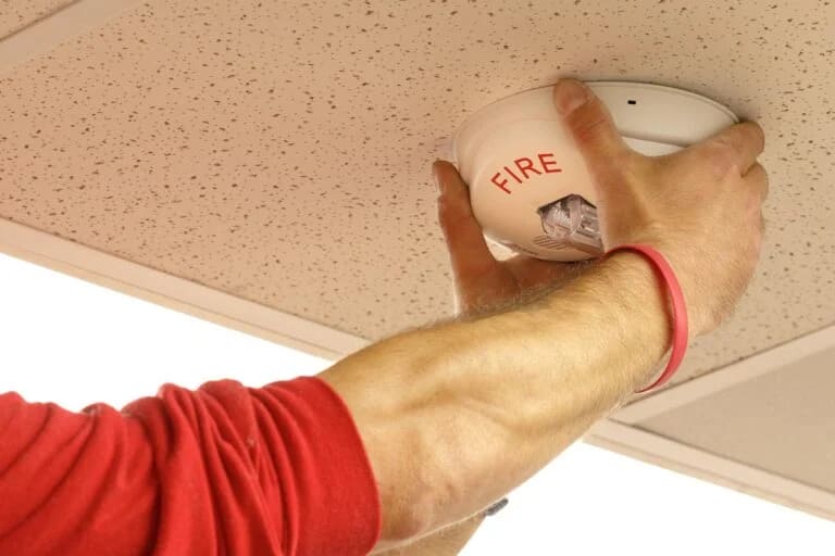 Fire tech installing horn strobe